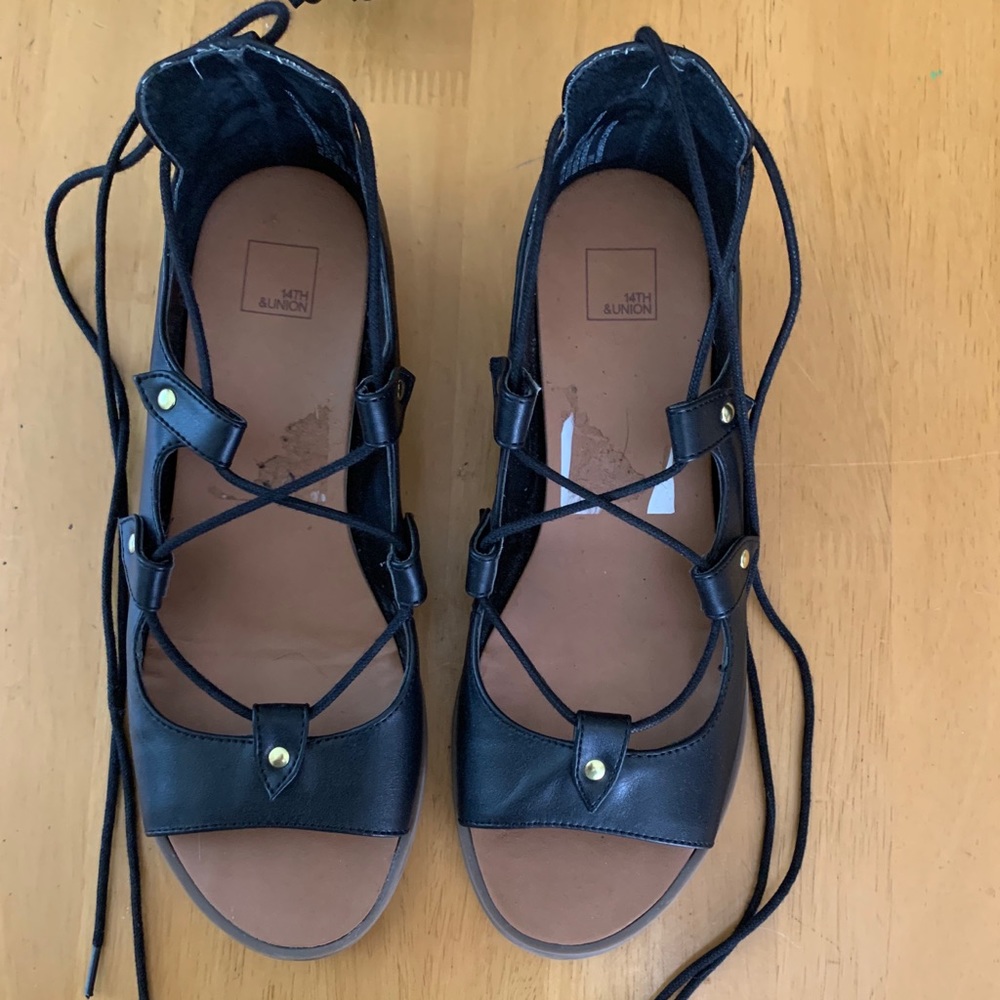 Laced up sandals.